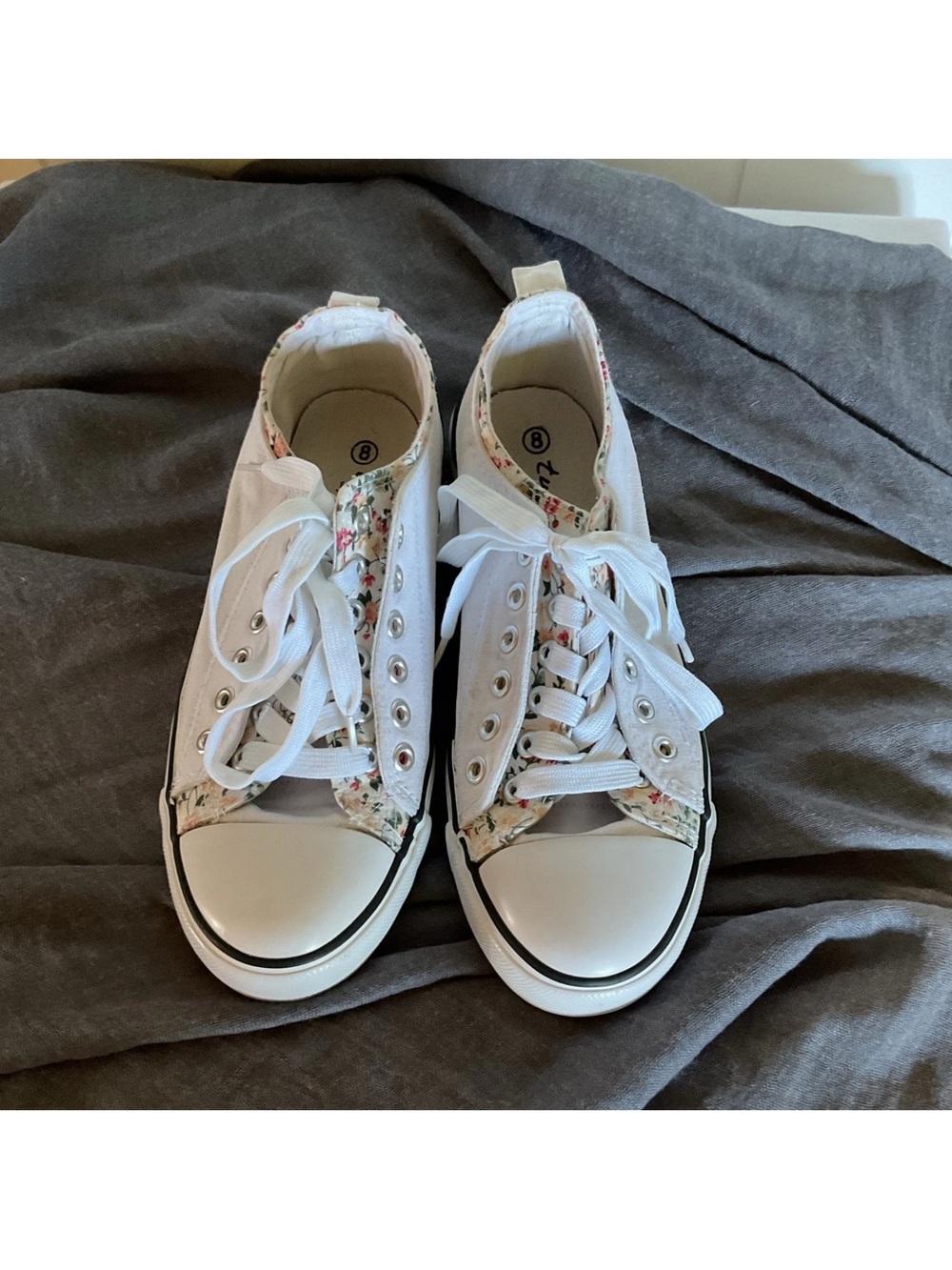 Twisted White Canvas Slip-On Sneakers with Subtle Floral Trim